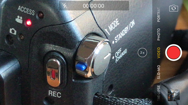 Record button on a JVC HM100 viewed through an Apple iPhone 7 plus
